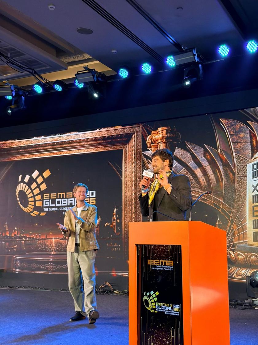 Telar's founder on stage at EEMAGINE 2026 in Chennai, in front of the event's giant screen.